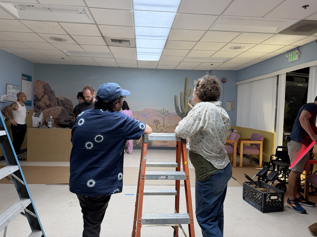 Director Tristan Seniuk and production designer Elmi Badenhorst prepare the set