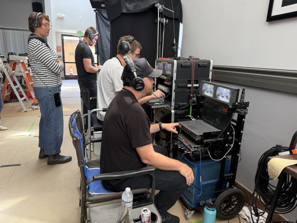 The Desert Palms production team reviewing immersive footage